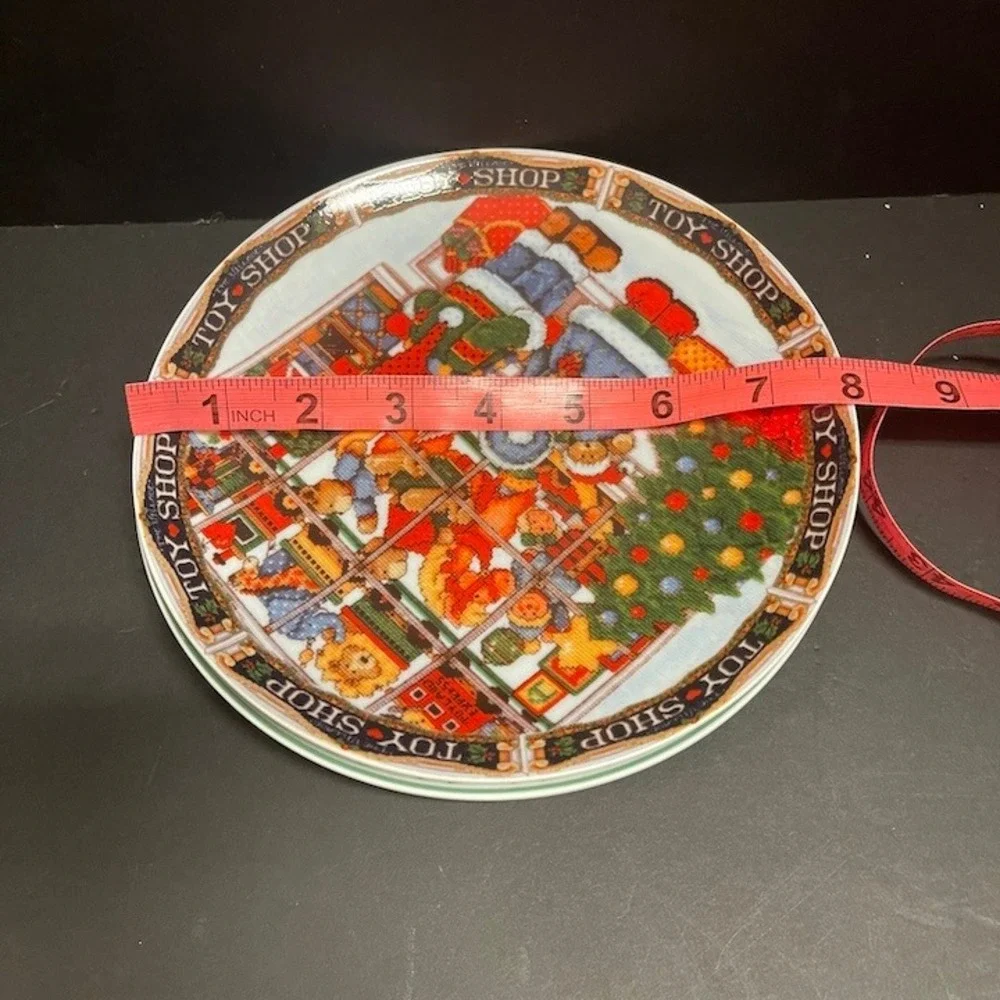 Lillian Vernon Christmas Plates Set 2 Santa Toy Shop Cross Stitch Style 7.5 in